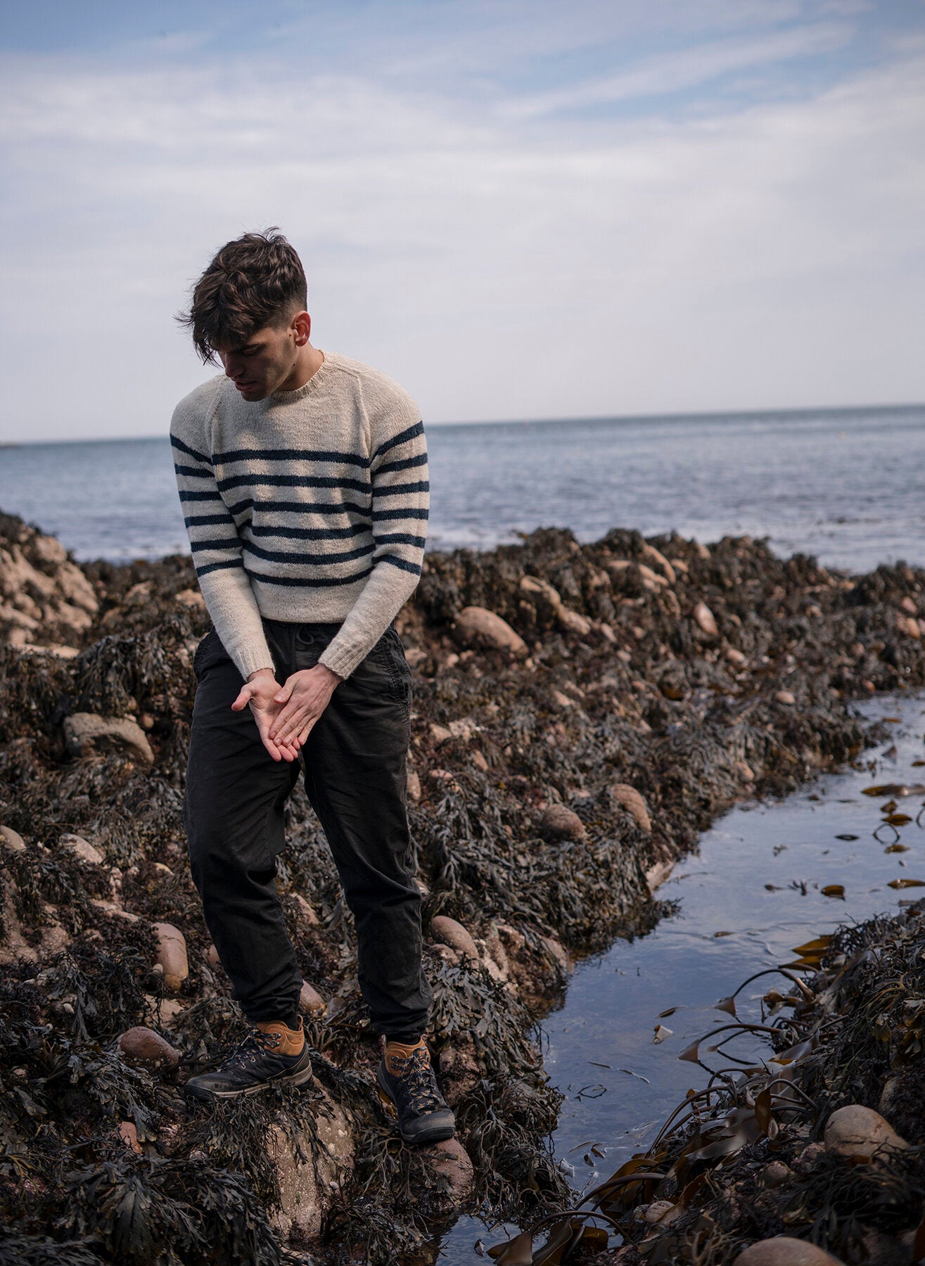 Endeavour by Lauriane Bernard. Bretton style striped sweater worn outside on the coast
