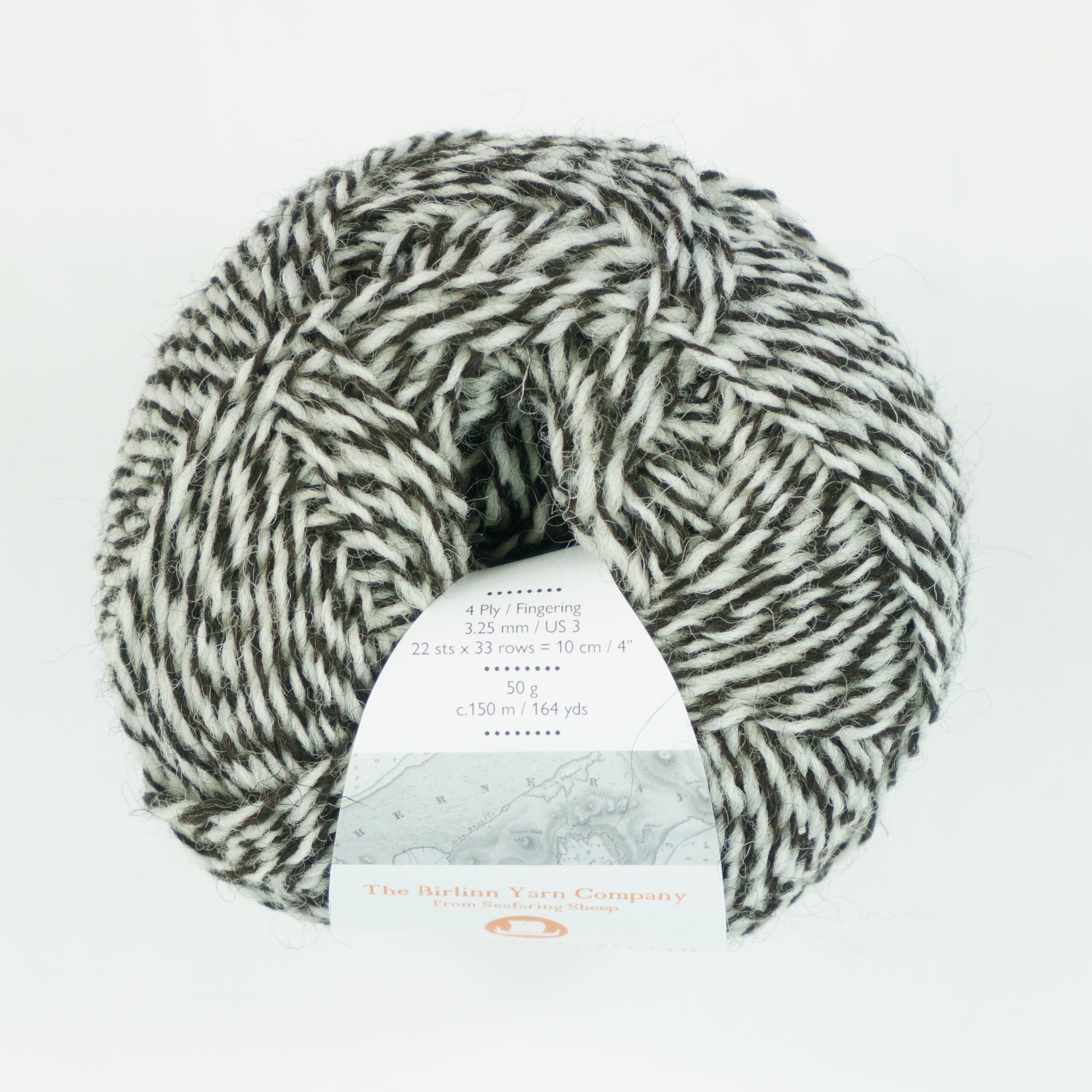 ball of Speckled Hen yarn from above: mix of whites and greys