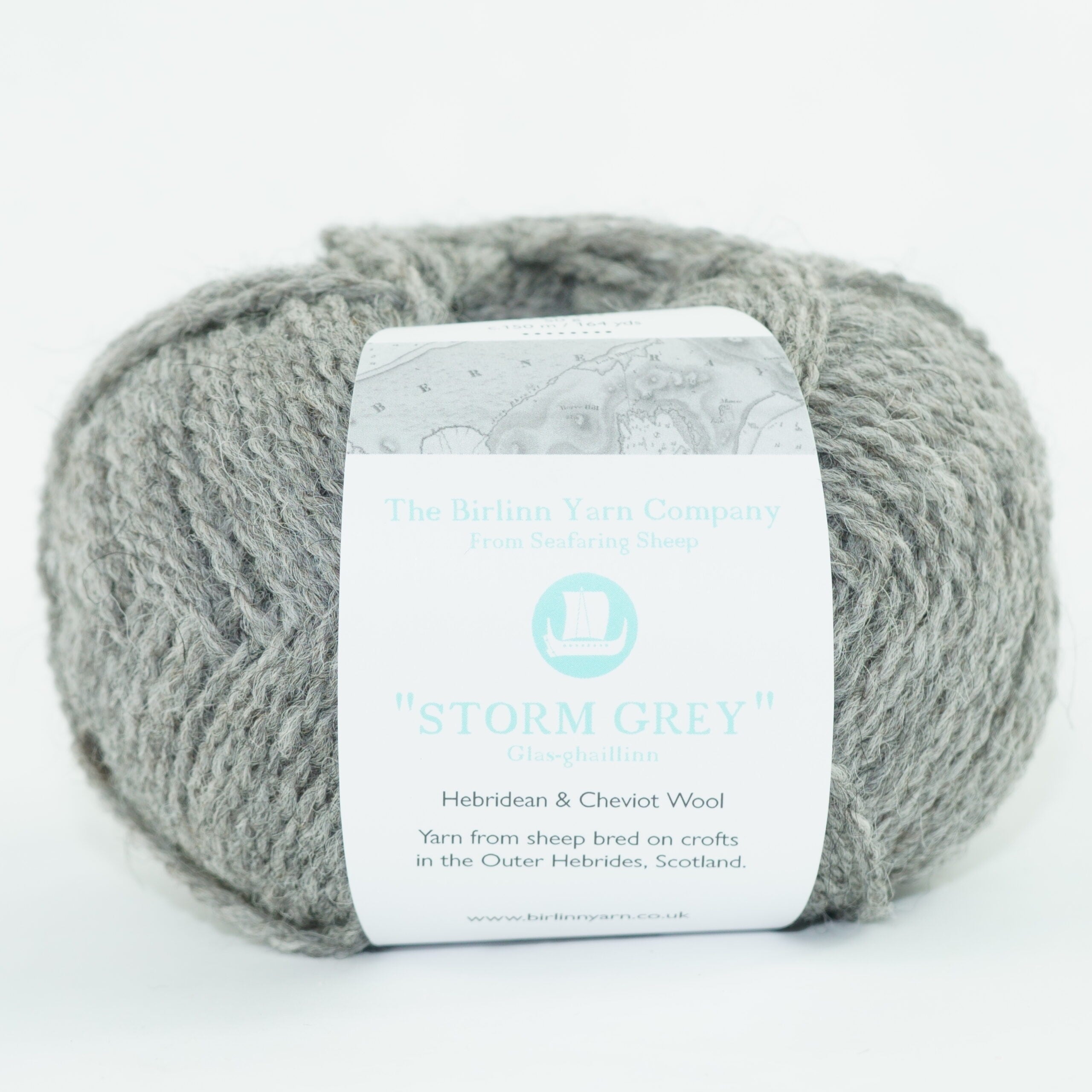 ball of Storm grey with label: A mid-tone grey 